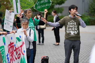 Developers begin cutting trees in a Tokyo park that environmentalists want to protect