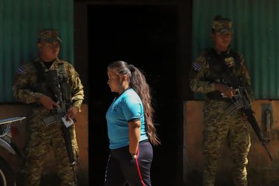 Thousands of soldiers fence off a Salvadoran neighborhood in pursuit of gang remnants