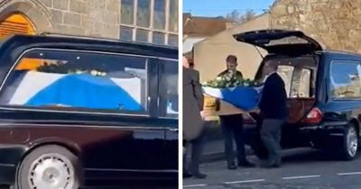 Alex Salmond's coffin arrives at private funeral draped in Saltire and met by piper