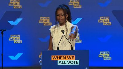 Michelle Obama stops Harris campaign speech to help audience member