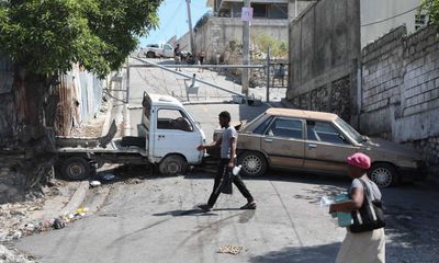 ‘This is effectively a civil war’: despair in Haiti as gangs step up assault on capital