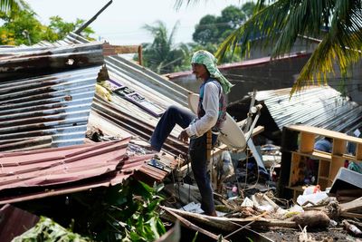 A powerful typhoon nears the Philippines, with many shelters still crammed after a recent storm