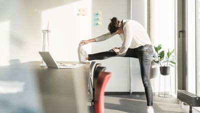 Feeling stiff after a day at your desk? A physical therapist recommends these four stretches to help you bounce back