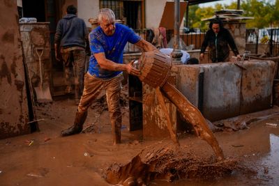 Spain searches for bodies after flood of the century claims at least 95 lives