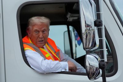 Trump dances onstage in hi-vis vest at Green Bay rally after driving garbage truck