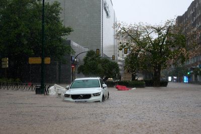 Is it safe to travel to Spain and should I cancel my holiday after flooding disaster?