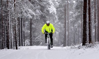 Expert tips on how to stay safe cycling in the dark and wet this winter