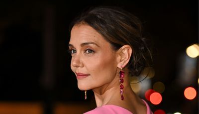 Katie Holmes embraces two-tone dressing in crimson red and powder pink dress - we're shopping identical pieces for Christmas