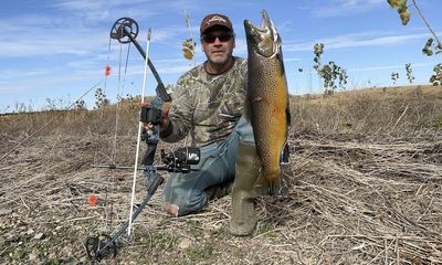 Bowfisherman shoots record brown trout, sparking anger online