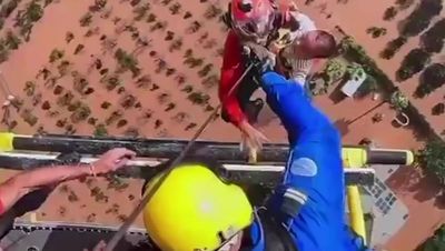 Watch: Woman and baby airlifted to safety from Spain’s flash floods by metal cage attached to helicopter