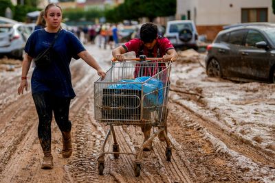 Flood survivors say regional Spanish officials waited too long to warn them of the danger