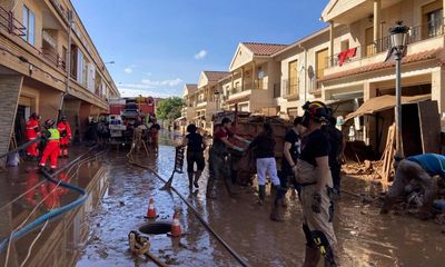 ‘I keep calling it a horror film’: Spaniards recount flooding as clean-up begins