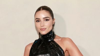 Olivia Culpo's vertical living room storage is a minimalist, modern twist on classic bookshelves – cream has never looked so interesting