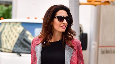 Amal Clooney’s striking red coat and check print trousers are the statement pieces our wardrobes need this winter