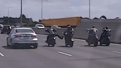 Bikies punch, kick L-plater riding on busy freeway