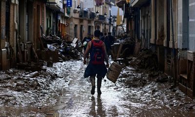 Spain floods: searchers scour car parks and malls amid fears death toll will rise