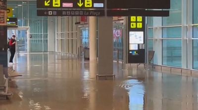 'Do not travel': Barcelona airport flooded with red alert rain warning issued and UK flights delayed