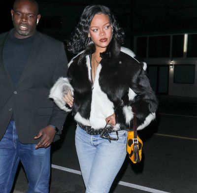 Rihanna Is the Poster Child for Fall’s Cow Print Trend, in a Fur Coat and Matching Fendi Baguette