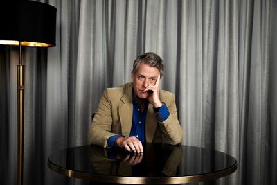 Hugh Grant spent half his career in rom-coms. Now he plays monsters, and he's never been happier