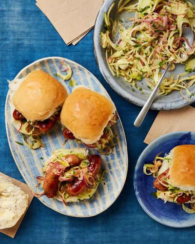 Georgina Hayden’s recipe for sausage baps with mustardy apple slaw