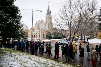 Free pizza and a DJ help defrost Montana voters lined up until 4 a.m. in the snow to vote