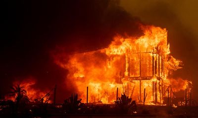 Californians forced to flee as ferocious wildfires destroy homes and buildings