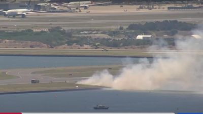 Probe into Qantas 'loud bang' engine fail, runway fire