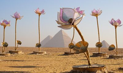 Giant flowers, a buried chariot and temples in the sand: the art show in the shadow of Giza pyramids