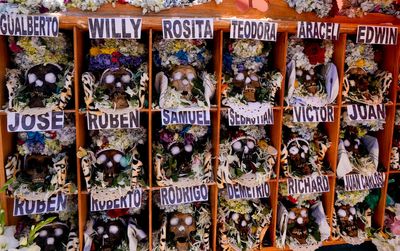 Bolivians carry adorned human skulls asking for favors in the Ñatitas festival in La Paz