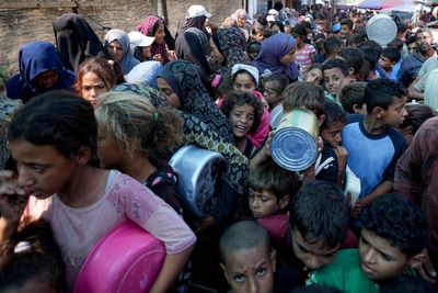Israeli strikes in Gaza kill at least 13, officials say, as first aid in weeks reaches the north
