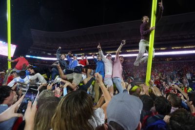 Ole Miss fans quickly tore down goalposts and carried them away after Georgia upset