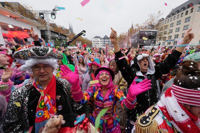 AP PHOTOS: Revelers in costumes take to the streets of Germany to kick off carnival celebrations