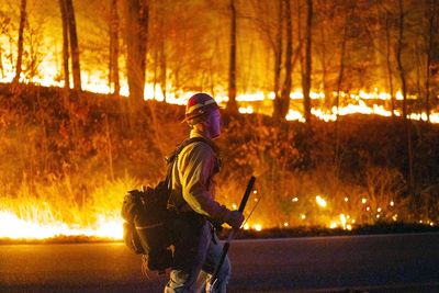 Aided by rain, crews extinguish a wildfire in Nevada after 1 home burns