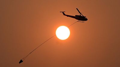 Anxious wait for town as bushfire fight continues