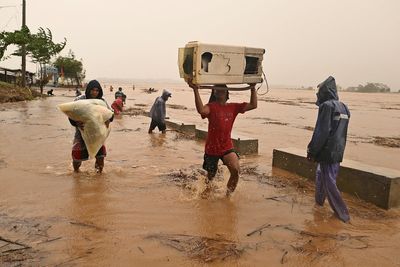 Typhoon batters storm-weary Philippines and displaces thousands more people as a new storm threatens