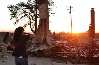 ‘Devastating’: California fire victims return to sift through rubble of homes