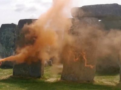 Two people charged by police after orange paint was thrown at Stonehenge in Just Stop Oil protest