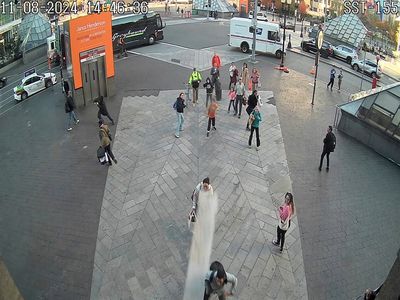 Falling scaffolding plank narrowly misses commuters outside train station