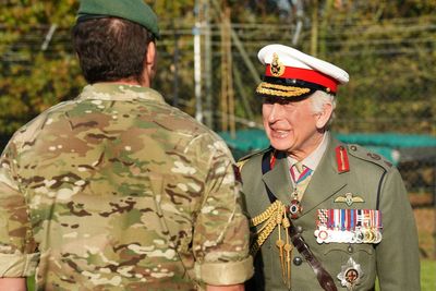 King returns to Royal Marines training base to meet recruits