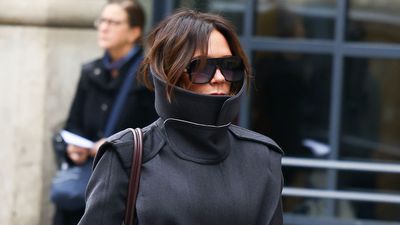 Victoria Beckham puts her own spin on Parisian style - who needs a scarf when you've got a supersized collar?