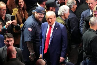 Trump takes a break from making Cabinet picks and attends UFC championship fight in New York