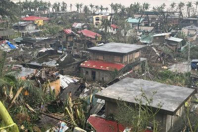 Latest typhoon batters the Philippines, causing tidal surges and displacing about 400,000 people