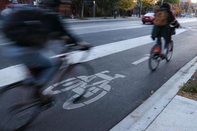 Bikes v cars: backlash after Ontario premier threatens to tear up cycling lanes in Toronto