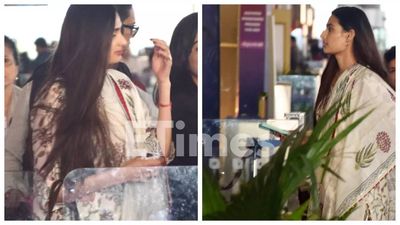 Athiya Shetty SPOTTED at the airport; Mommy-to-be shields baby bump as she dodges paparazzi