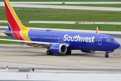 Emergency evacuation on Southwest plane after phone catches fire and seat goes up in flames