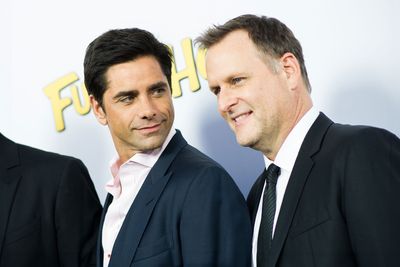 Coulier defends Stamos wearing bald cap