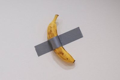 Banana duct-taped to wall bought at art auction for $6.2m by crypto mogul who plans to eat it