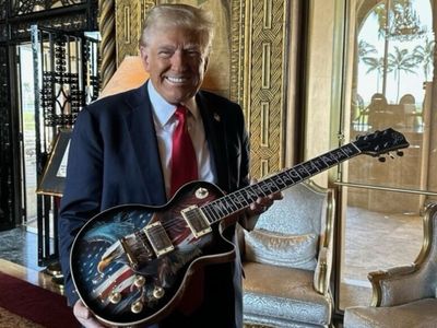 Trump unveils latest merchandise grift: $10,500 signed American Eagle guitars in time for Christmas