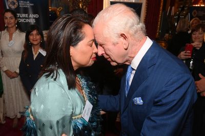 King shares traditional greetings with Maori attendee at charity launch