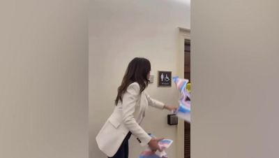 Nancy Mace tears down trans bathroom posters and throws them in trash in response to bill protest